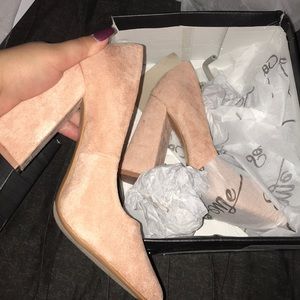 Nude/blush pumps.
